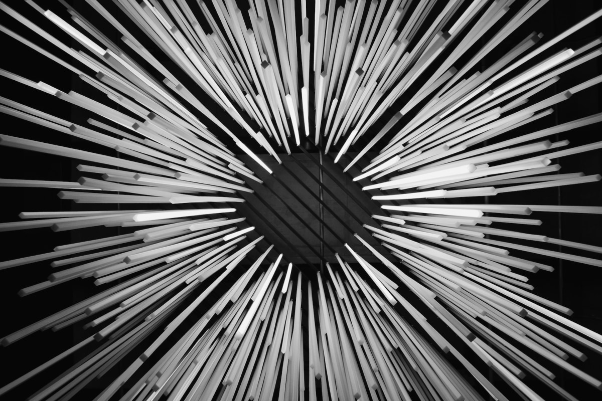 Radiating rods forming an energetic portal in black and white