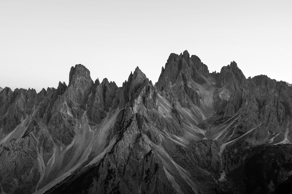 Jagged mountains, symbolizing burdens and resilience